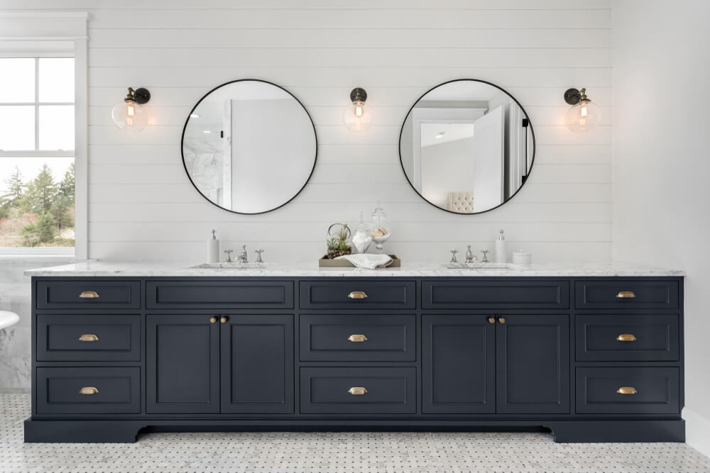 Large Double Vanity in Master Bathroom in New Luxury Home. photo by Breadmaker / Shutterstock
